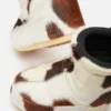 Icon Low laarsjes zonder veters met koeienprint